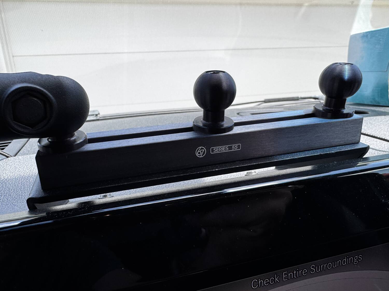 Close-up of the 67 Designs Series 55 dash bar with ball mounts