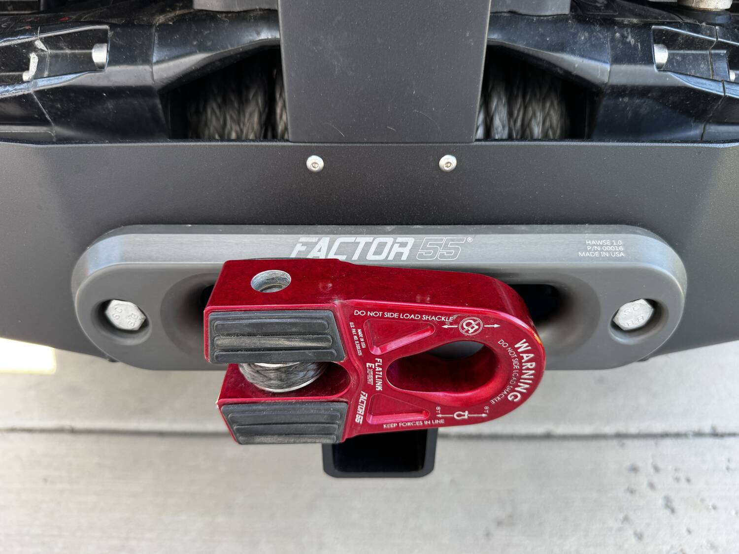 Close-up of the Factor 55 FlatLink E shackle attached to the synthetic winch line