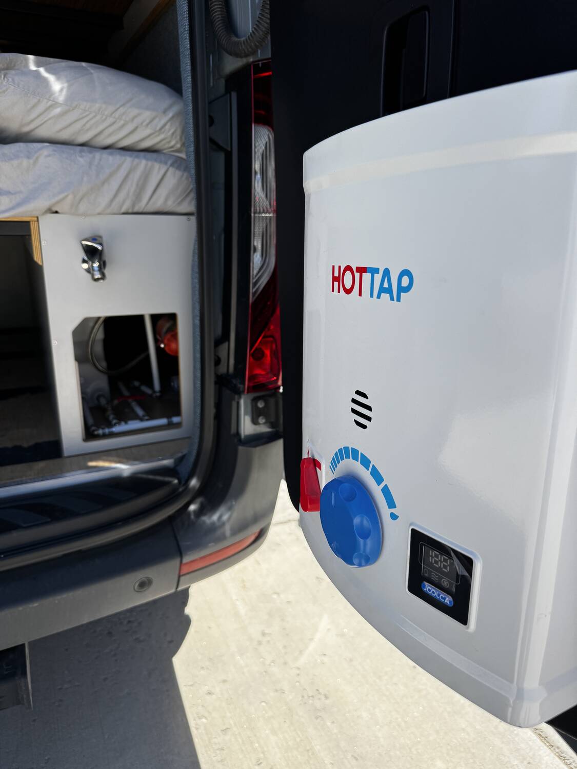 Joolca HotTap V2 mounted to the rear door with digital temperature display lit