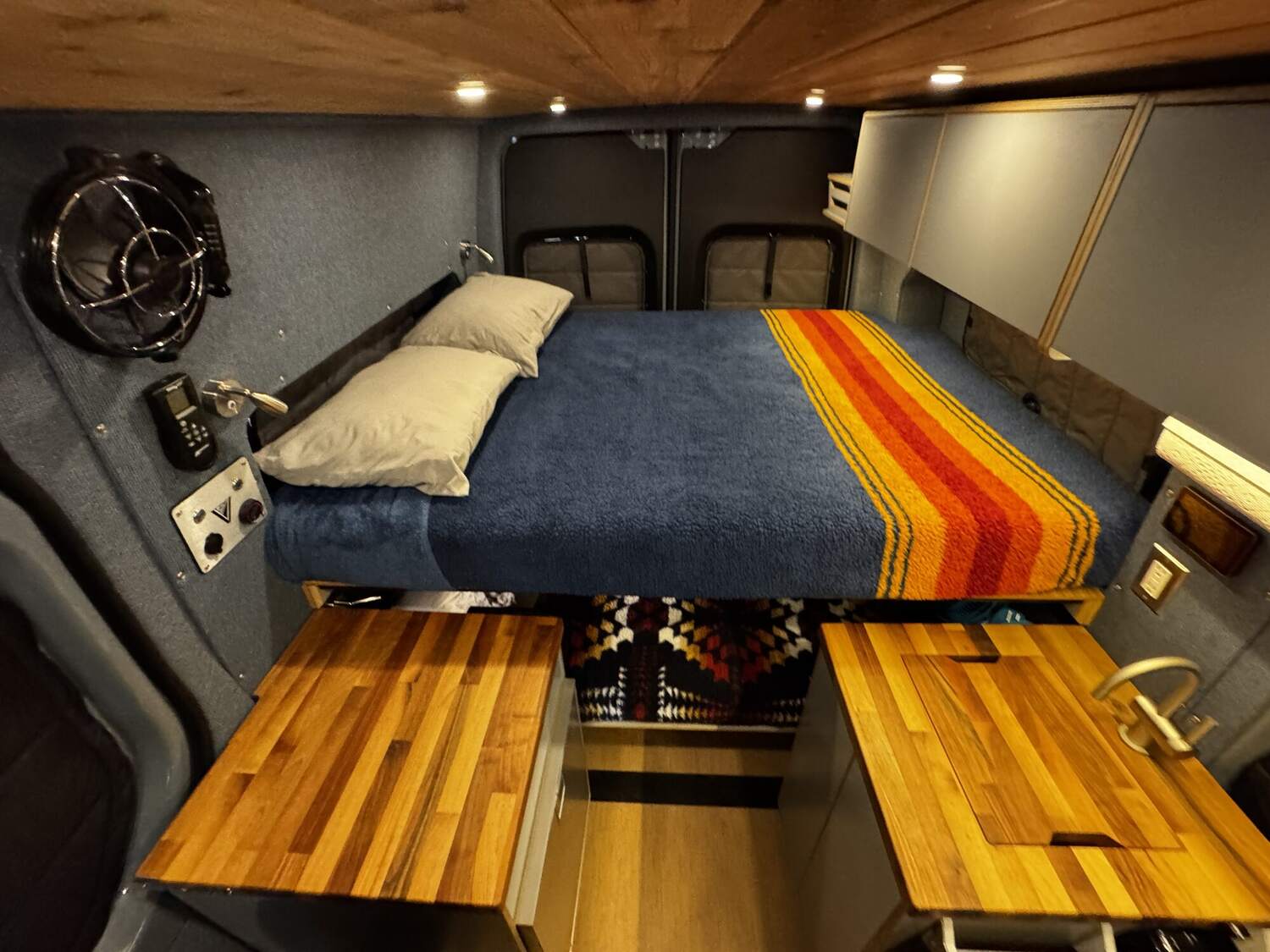 Upper bunk with butcher-block counters below