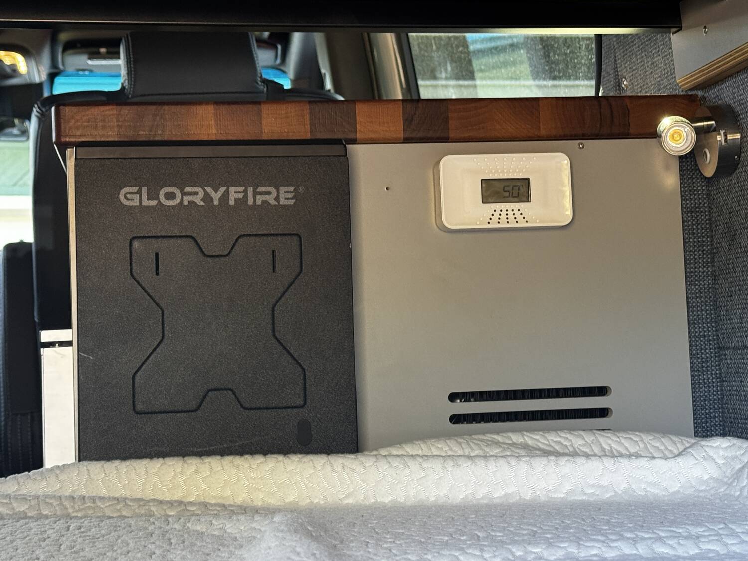 GloryFire handgun safe mounted beside a First Alert carbon monoxide detector under the rear bunk