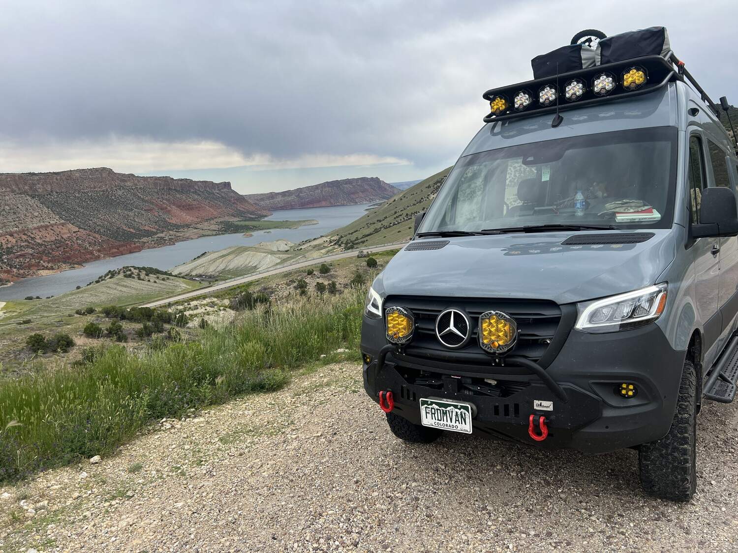 Front three-quarter view above a Utah canyon and reservoir