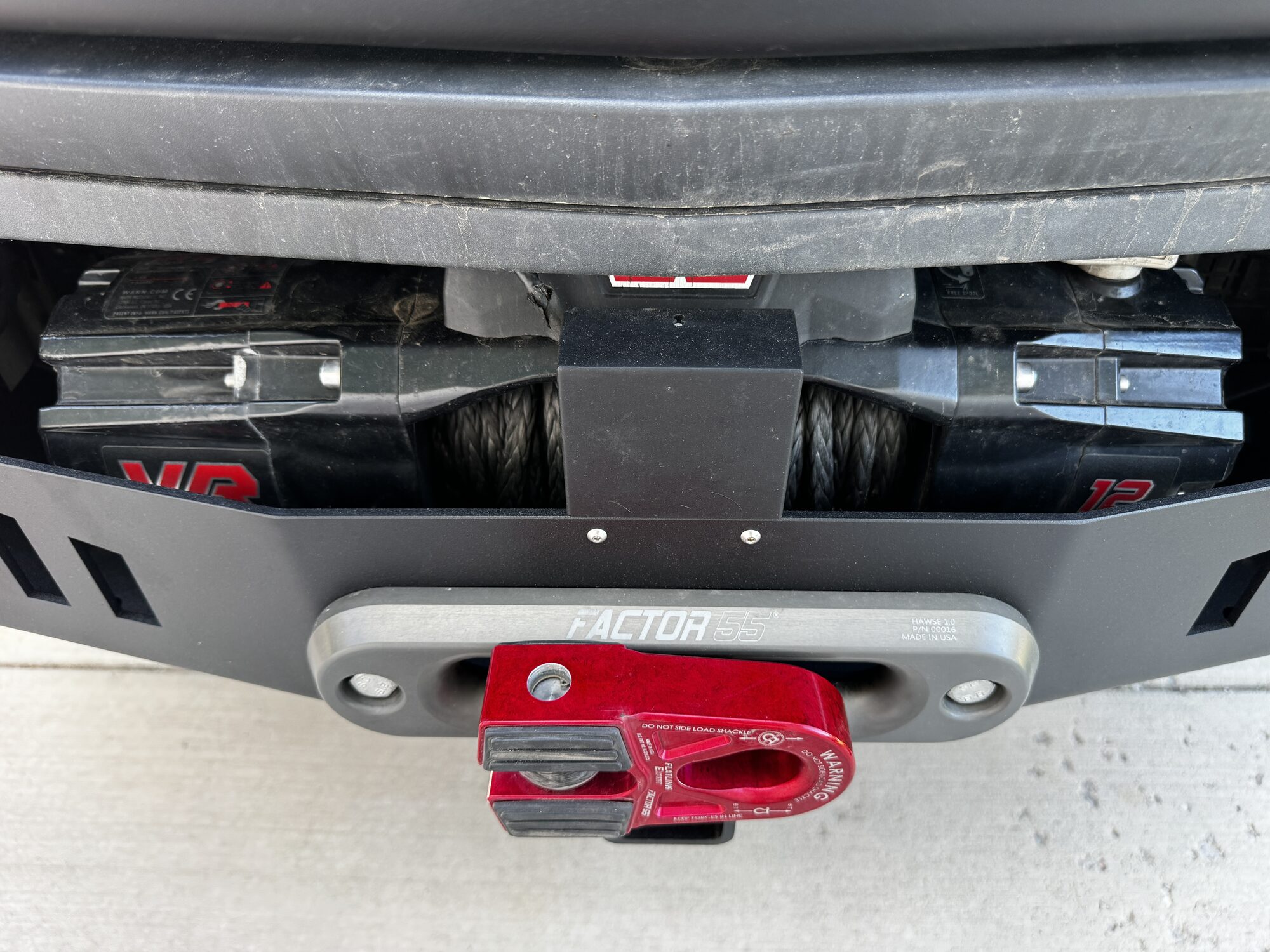Warn VR EVO winch with synthetic rope tucked inside the CA Tuned front bumper above the Factor 55 fairlead