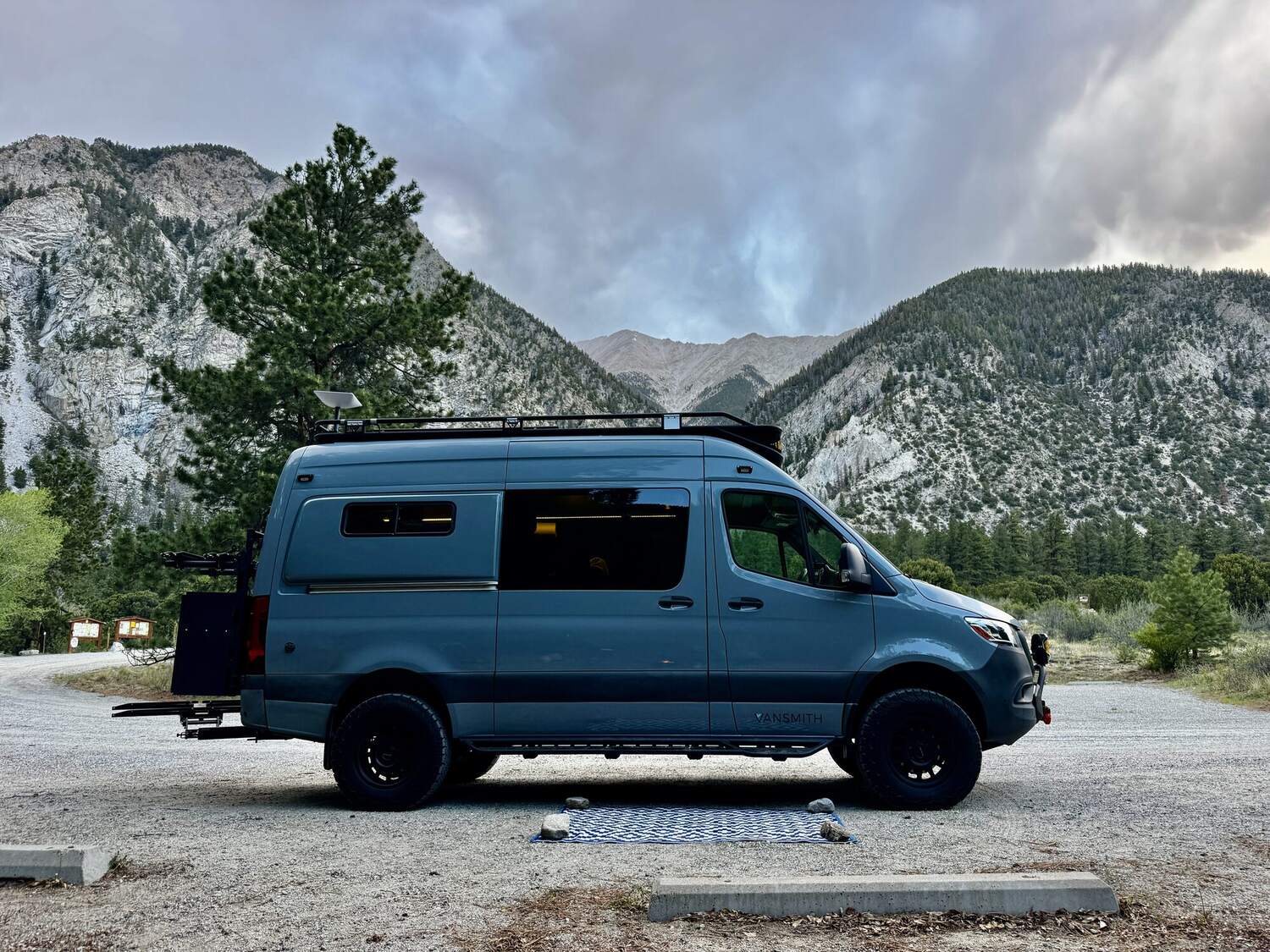 Passenger-side profile of the Sprinter at dusk in the Colorado high country