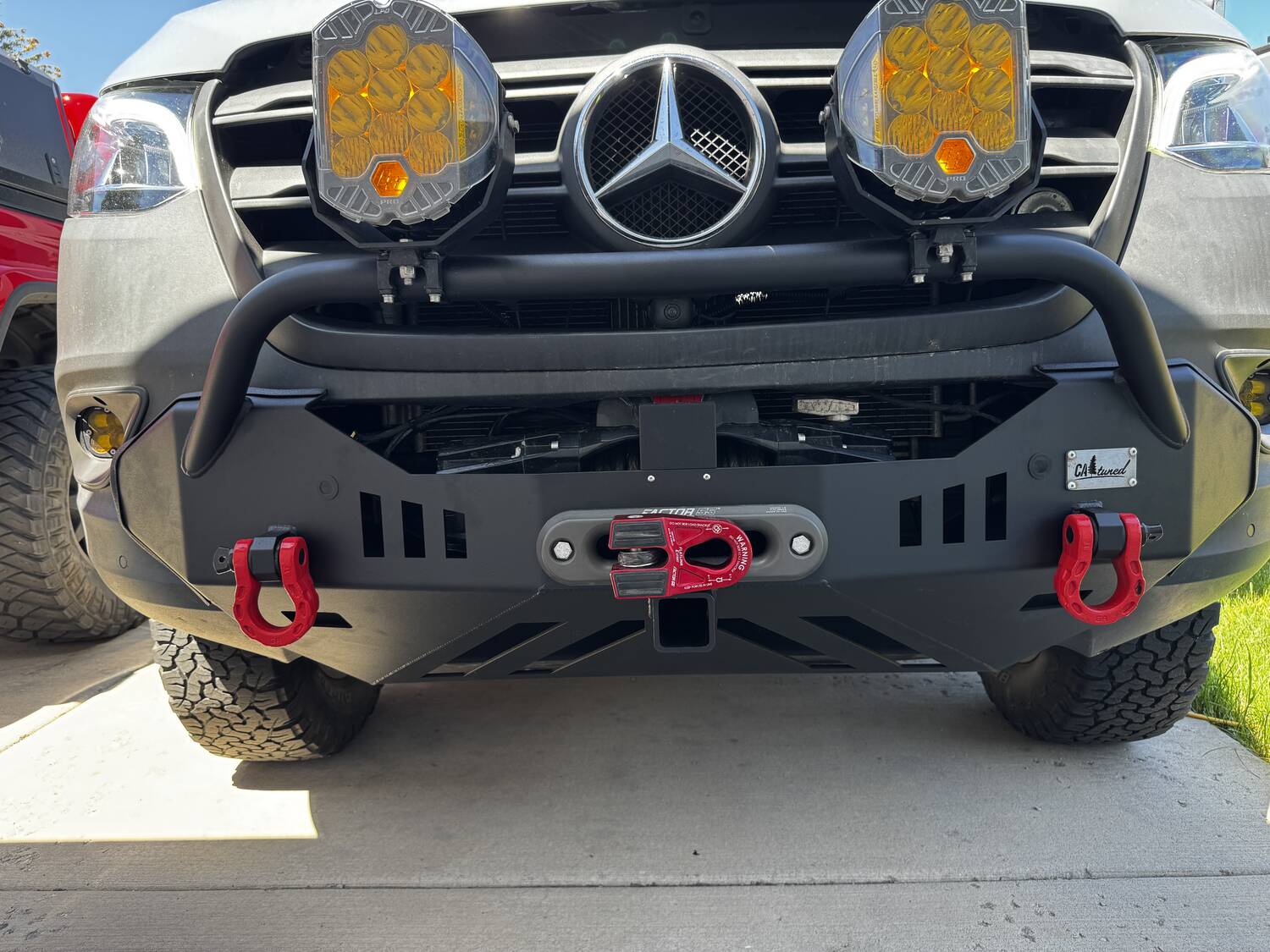 CA Tuned front bumper with LP9 lights, hoop, red shackles and Factor 55 FlatLink