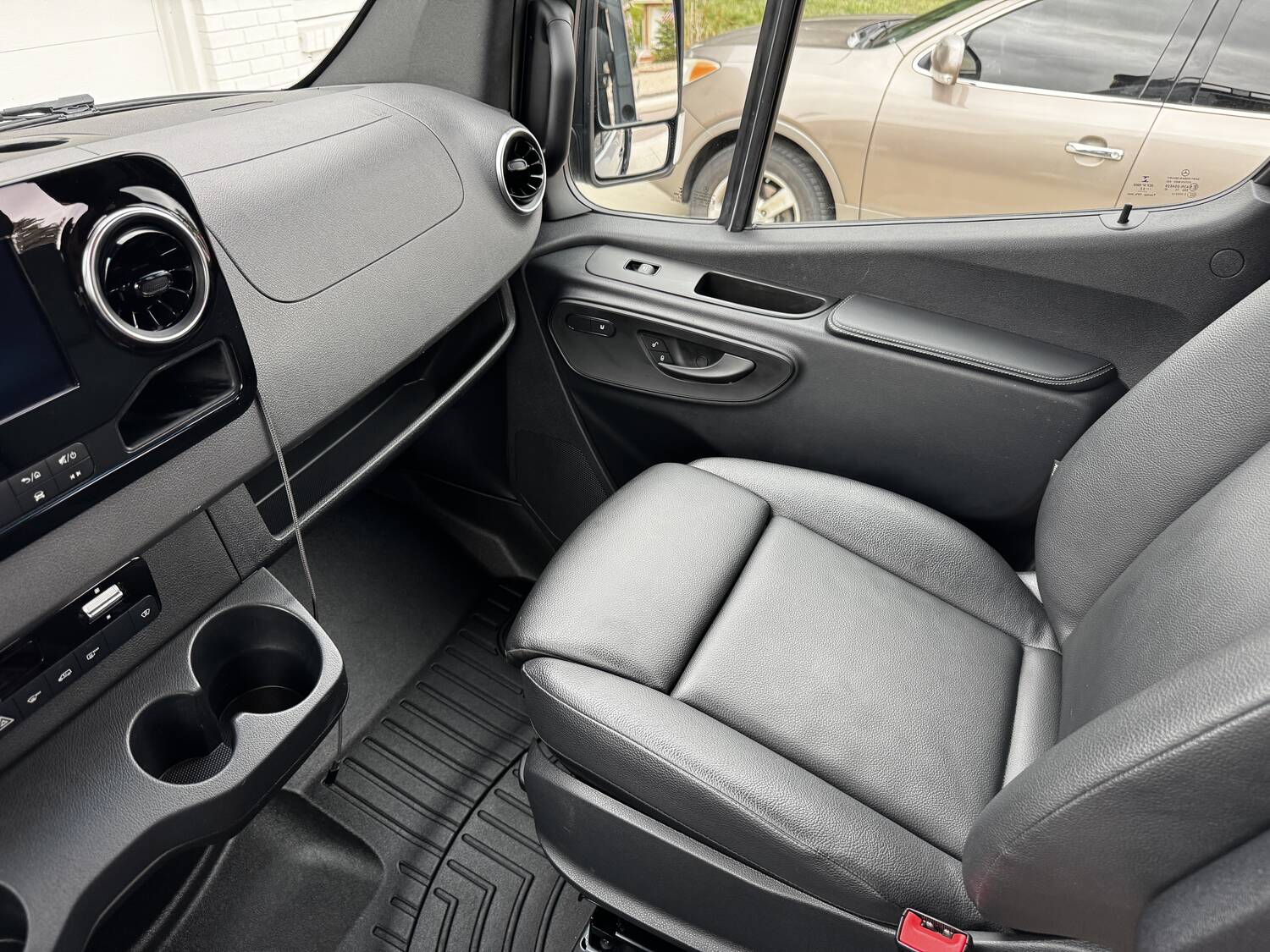 Black leatherette driver seat, door switches and dash trim
