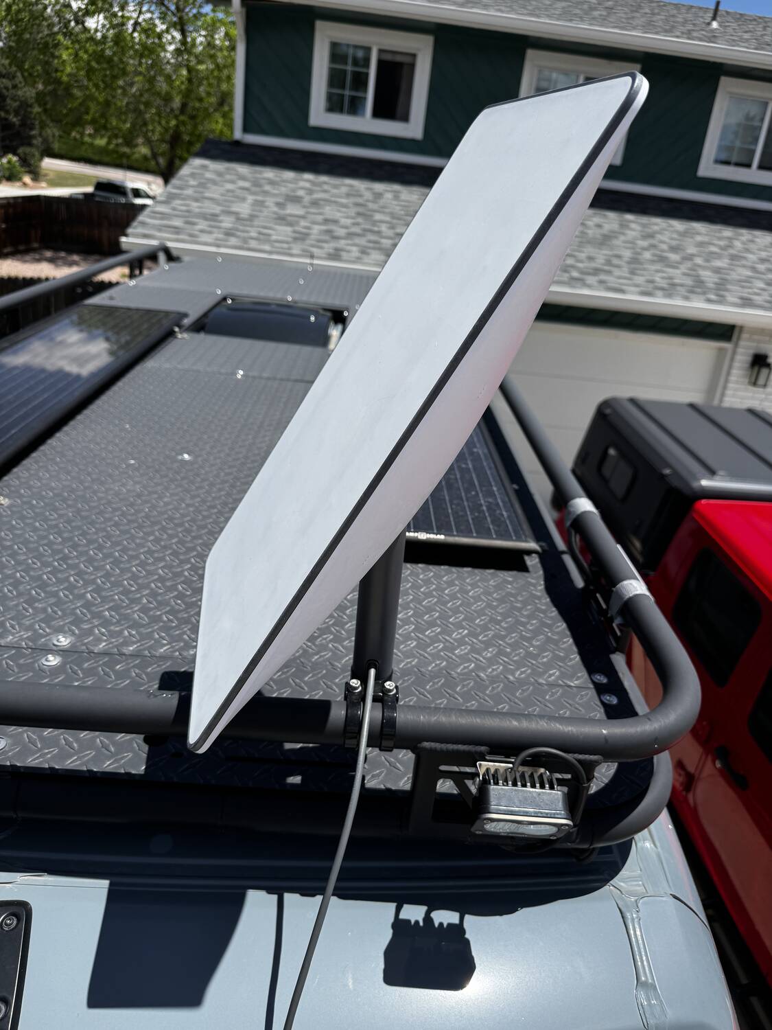 Starlink Gen-2 dish mounted to the Vansmith roof rack with solar panels beside it